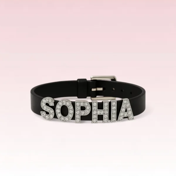 Studio product photo: black PU leather rhinestone name bracelet “SOPHIA”, front view