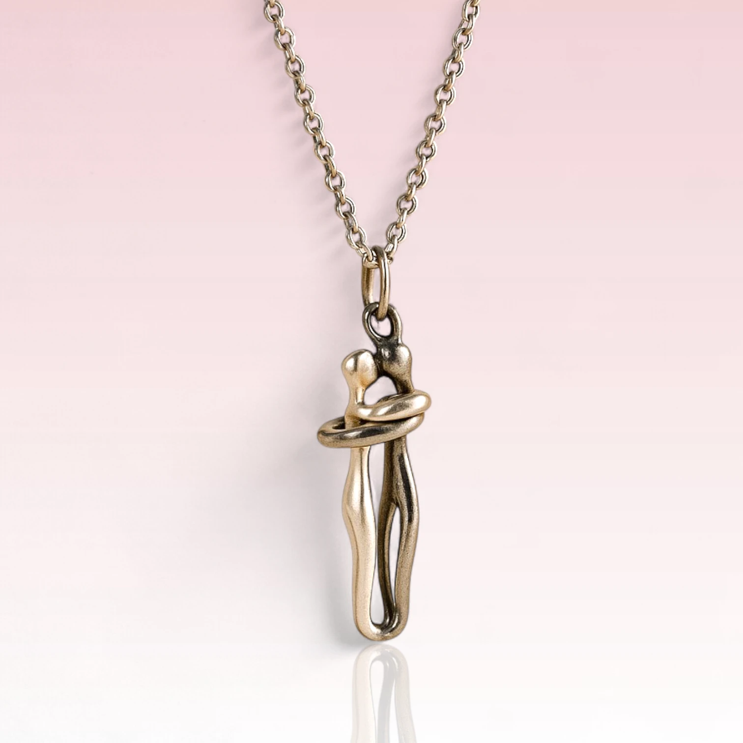 Sterling silver couple hugging necklace